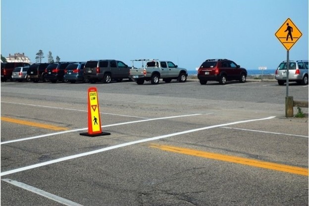 A parking lot with cars parked in the background

AI-generated content may be incorrect.